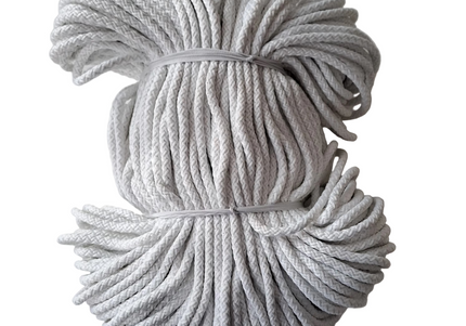 Coiled white rope on a light gray background