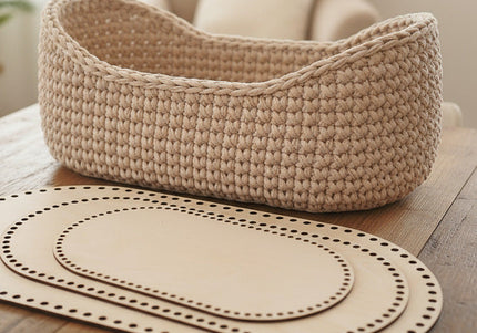 Woven basket and placemats on a wooden table with a blurred background