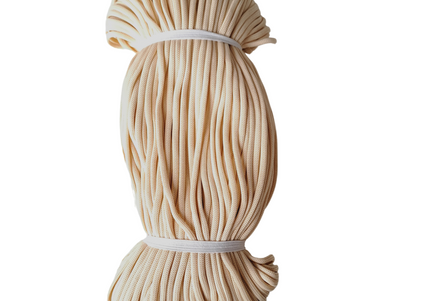 Beige rope tied into a bundle on a white background