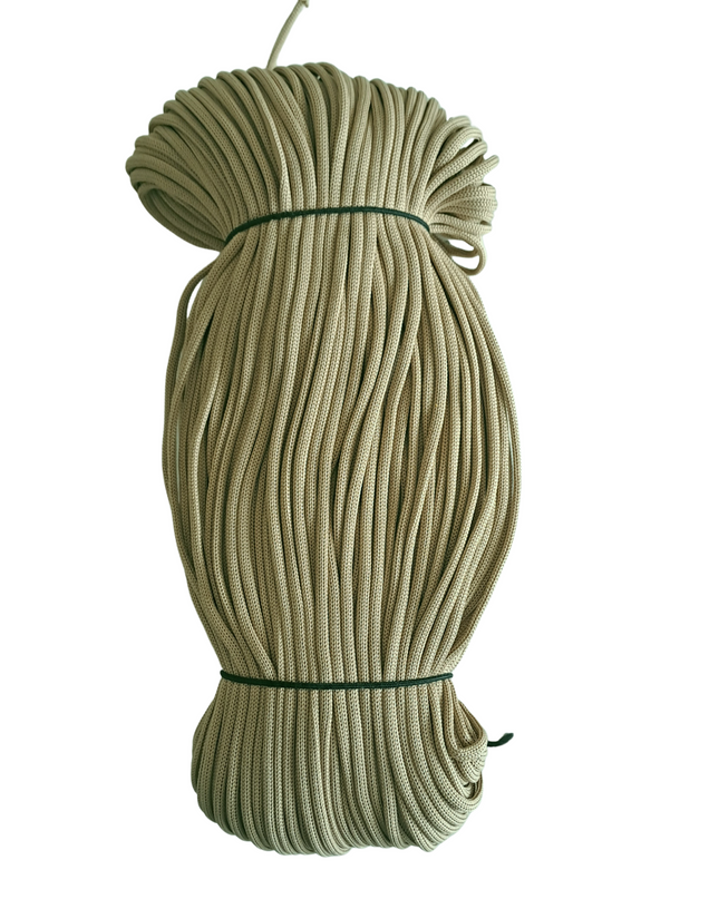 Coiled green rope on a white background